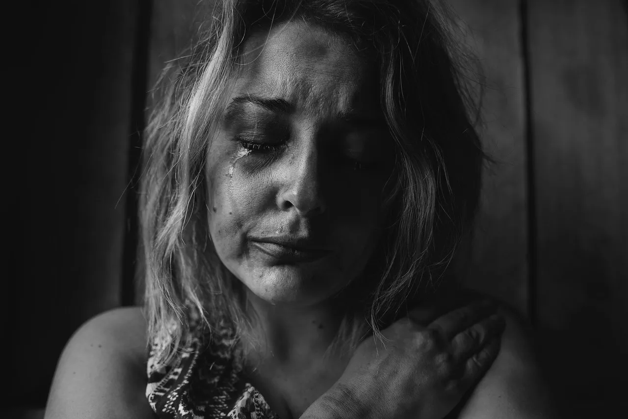 image of distressed woman in pain