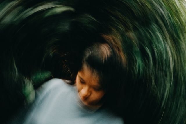 Person experiencing dizziness after a car accident